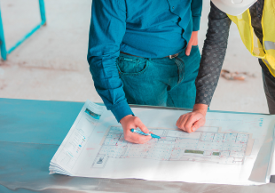 Engineers reviewing installation plans on site