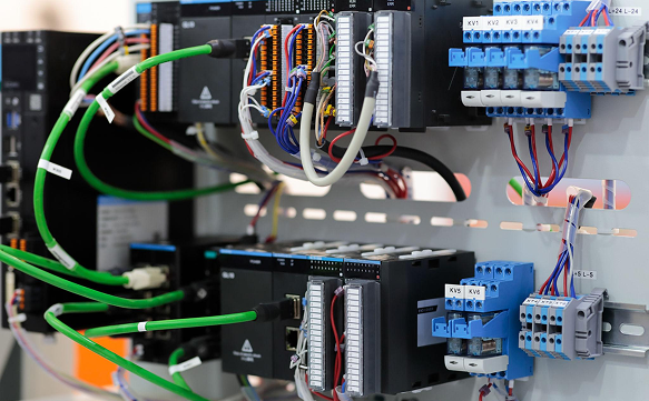 PLC automation panel with wired controllers and relay modules